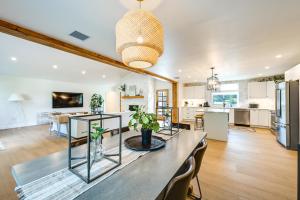 a kitchen and living room with a table and chairs at Naples Duplex Home with Private Pool and Lanai! in Naples