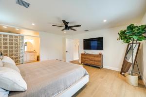 a bedroom with a bed and a ceiling fan at Naples Duplex Home with Private Pool and Lanai! in Naples