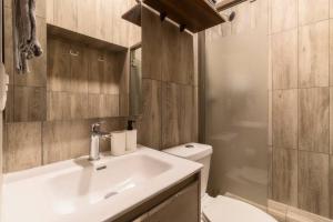 a bathroom with a sink and a toilet and a shower at 105 Centrico Zocalo apt 2Bdrm 2bath AC Rooftop in Mexico City