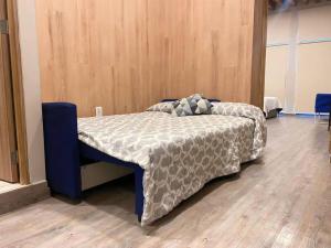 a bedroom with a bed with a comforter on it at 105 Centrico Zocalo apt 2Bdrm 2bath AC Rooftop in Mexico City