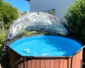 a hot tub with a plastic cover on top of it at Ferienwohnung Familie Sobierajczyk - Fewo unweit Ostsee in Blankenhagen