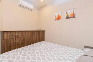a bedroom with a bed and a wooden cabinet at 406 Location 2Bdrm 2baths AC Rooftop in Mexico City