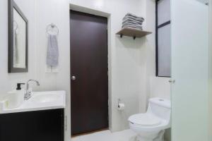 a bathroom with a toilet and a sink at 406 Location 2Bdrm 2baths AC Rooftop in Mexico City