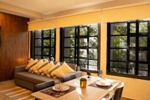 a living room with a couch and a table at 202 Walk the City Center 1bdrm 2bath AC Apt in Mexico City