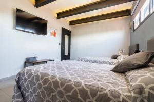 a bedroom with two beds in a room at 2Ph Large 2Brm 3 bath AC private terrace apt in Mexico City