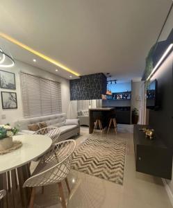 Μια τηλεόραση ή/και κέντρο ψυχαγωγίας στο Apartamento aconchegante