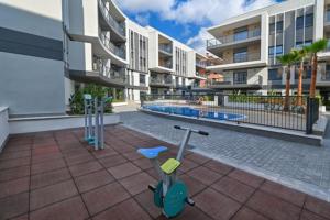 a scooter parked in the courtyard of a building at Boho chic in Jávea