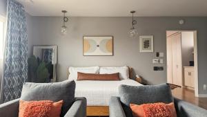 a bedroom with a bed and two couches at LA Huge Mid Century Guesthouse Patio LAX Beach in Los Angeles +29 photos