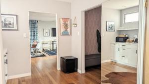 a living room with a hallway with a mirror at LA Huge Mid Century Guesthouse Patio LAX Beach in Los Angeles