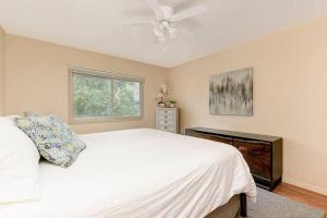 a bedroom with a white bed and a ceiling fan at Casa Amore -2BR- FREE Driveway parking for 3 cars in San Diego