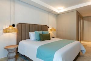 Ένα ή περισσότερα κρεβάτια σε δωμάτιο στο Oz Hotel Cartagena