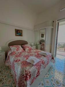 a bedroom with a bed and a large mirror at Capri Suite Dreams in Capri