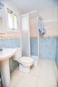 a bathroom with a toilet and a sink at Equipped Centric Apartment with large terrace in Lloret de Mar