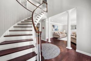 a spiral staircase in a home with a living room at Mansion With Private Pool Basketball & Tennis courts in Fayetteville