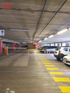 a parking lot with cars parked in a parking garage at Appartement bien situé in Noisy-le-Grand