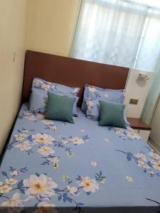 Ένα ή περισσότερα κρεβάτια σε δωμάτιο στο Swahili home-Mbeya City