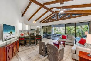 a kitchen and living room with a couch and a table at Peaceful Garden Villa in Sardinal