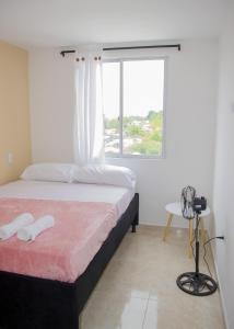 מיטה או מיטות בחדר ב-Quimbaya