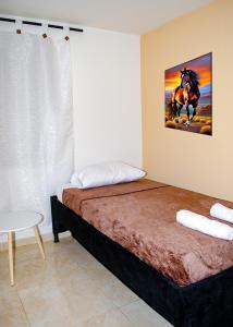 Llit o llits en una habitació de Quimbaya
