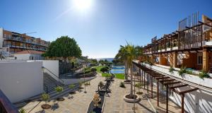 a view of the courtyard of a resort with a pool at CASA TITINA in San Miguel de Abona