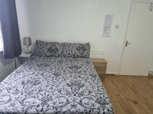 A bed or beds in a room at Private Double Room in London