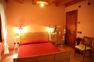 Postel nebo postele na pokoji v ubytování Agriturismo Corte Pellegrini