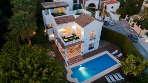 an overhead view of a house with a swimming pool at VACATION MARBELLA I Villa Nadal, Private Pool, Lush Garden, Best Beaches at Your Doorstep in Marbella