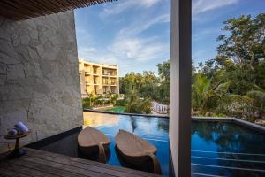 a view from the lobby of a resort with a swimming pool at Secrets Tulum Resort & Beach Club - Adults Only - All Inclusive in Tulum