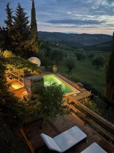 a swimming pool in the middle of a yard at Casa Panzano Tuscany in Panzano