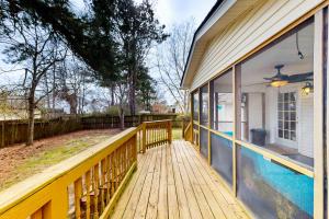 a wooden deck with a swimming pool on a house at Southern Sanctuary in Ladson