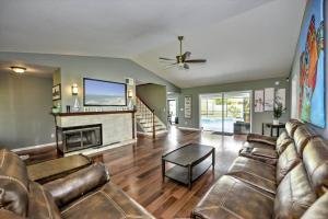 a living room with a couch and a fireplace at Cape Coral Paradise 4 BD 12sleeps, W/heated pool in Cape Coral
