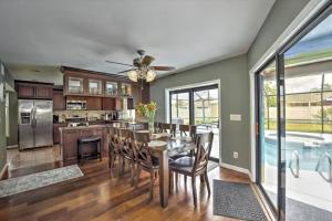 a kitchen and dining room with a table and chairs at Cape Coral Paradise 4 BD 12sleeps, W/heated pool in Cape Coral