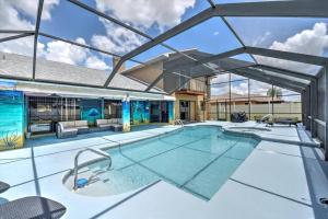 an indoor swimming pool with a large glass ceiling at Cape Coral Paradise 4 BD 12sleeps, W/heated pool in Cape Coral