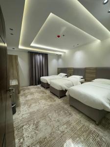 Katil atau katil-katil dalam bilik di قمم بارك النماص 8 Qimam Park Hotel