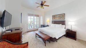 a bedroom with a bed and a ceiling fan at LV022 Centrally Located Downstairs LV Studio in La Quinta
