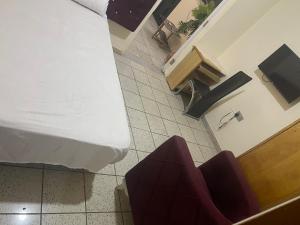 an overhead view of a hospital room with a bed and chairs at Best Yessit Homestay in Abuja