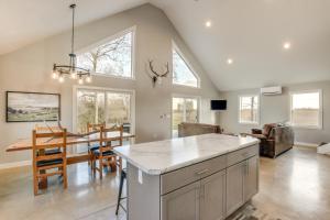 a kitchen and dining room with a table and chairs at Modern Oskaloosa Cabin with 2 Acres and On-Site Trails in Oskaloosa