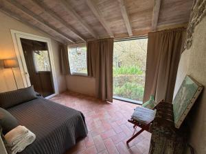 A bed or beds in a room at Il frantoio di Luna - Levanto, 5 Terre