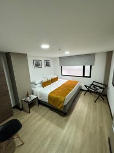 Postel nebo postele na pokoji v ubytování Hotel WLH Gold Bogota