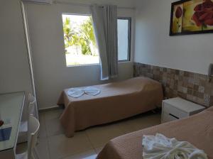 Ένα ή περισσότερα κρεβάτια σε δωμάτιο στο Flat 109 Carneiros Tamandare Marinas Terreo +13 φωτογραφίες