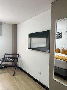 Postel nebo postele na pokoji v ubytování Hotel WLH Gold Bogota