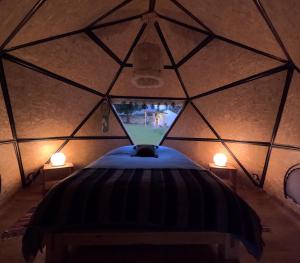 a room with a round bed in a yurt at Domos Cordillera Blanca in Huaraz