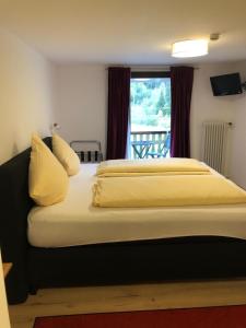 Postel nebo postele na pokoji v ubytování Gasthaus Hotel Löffelschmiede + 21 fotografií