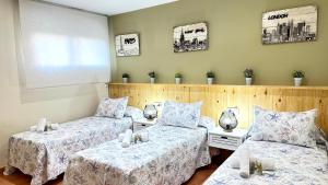 a room with two beds and two tables at CASAS DEL MAR - Oliva Nova - Primera línea de Playa in Oliva +151 photos