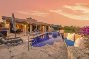 a swimming pool in the middle of a house at Casa Stamm in Cabo San Lucas