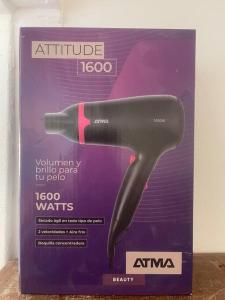 a black hair dryer in a box on a table at Centro Porteño in Buenos Aires