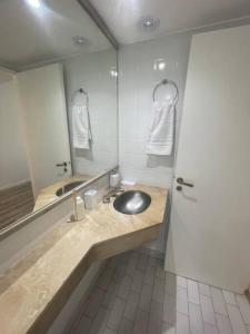 a bathroom with a sink and a mirror at Centro Porteño in Buenos Aires +7 photos