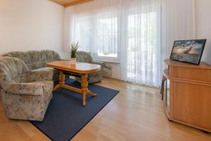 Et tv og/eller underholdning på Räuberkuhle II Ferienbungalow 12