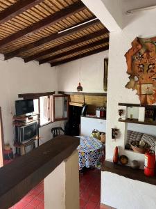 a room with a kitchen with a table in it at La Ramada in Tafí del Valle