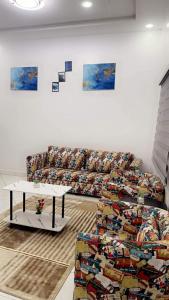 a living room with a couch and a table at Best Residence in Nouakchott